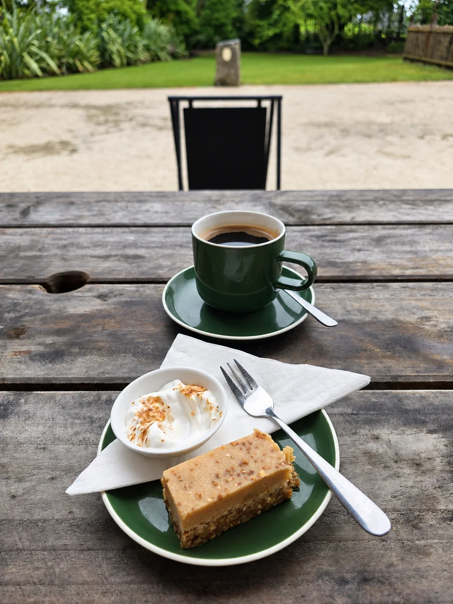 Coffee and cake served outside at Omanawa Cafe